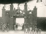 a group of people standing in front of a building