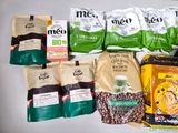 many different types of coffee bags on the table