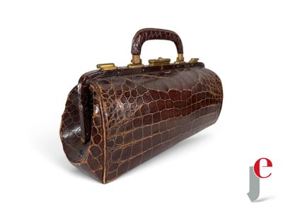 an image of a brown crocodile skin handbag on a white background