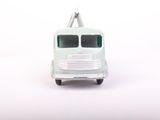 a toy truck that is sitting on a white surface
