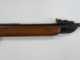 a rifle on a white background