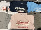 a lot of t - shirts that are on a table