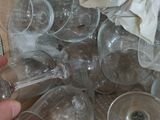 many empty wine glasses in a box on the floor