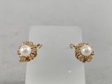a pair of pearl and diamond stud earrings