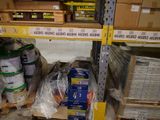 many boxes of paint on the shelves in the store