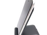a cell phone that is sitting on top of a stand