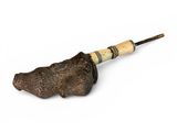 a small animal head on a stick with a wooden handle