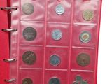 a red book with a bunch of coins inside of it