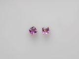 a pair of amethorate earrings on a white background