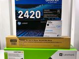 three toner cartridges are stacked on top of each other on a table