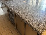 a kitchen with a counter and a sink in it