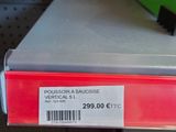 a red box with a price label on it in a store