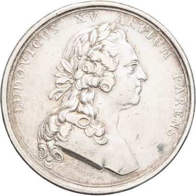 a close up of a coin with a woman ' s head on it