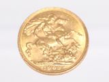 a gold coin with a picture of a man riding a horse