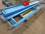 several pieces of metal are stacked on top of each other in a warehouse