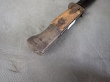 a knife that is laying on top of a piece of cloth