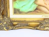 a painting of a woman holding a baby in a gold frame