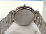 a close up of a watch on a white surface