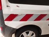 a white van with a red stripe on the side of it