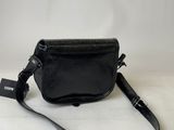a black leather purse with a black strap and a white tag on it