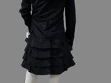 the back view of a mannequin wearing a black dress and jacket