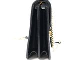 black leather wallet with gold chain on a white background