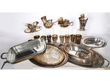 a lot of silverware sitting on a table
