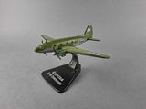 a small model of a green airplane on a stand