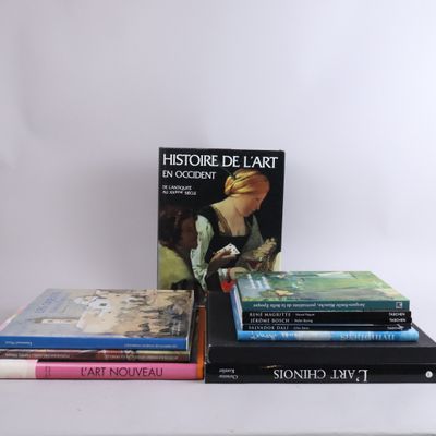 several books are stacked on top of each other on a table