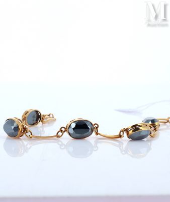 gold plated bracelet with black glass beads and gold chain