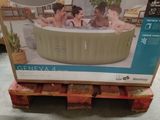 an inflatable hot tub sitting on top of a pallet in a store