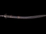 an image of a very old knife on a black background