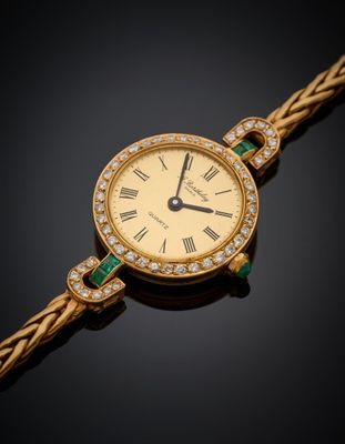 une montre pour femme sertie de diamants et d'émeraudes