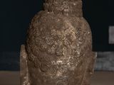 a statue of a bird sitting on a table