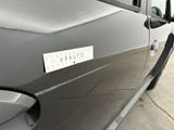 a close up of a car door with a sticker on it