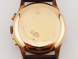 an image of a close up of a watch on a white surface