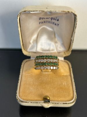 a close up of a ring in a box on a table