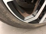 a close up of a car tire with a flat tire