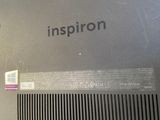 the back of a laptop with the word inspiron written on it