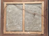 an old picture of a window frame with a broken glass in it