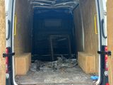the back of a van with the door open and the back of the van with the door open