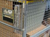 many boxes stacked on top of each other on a cart