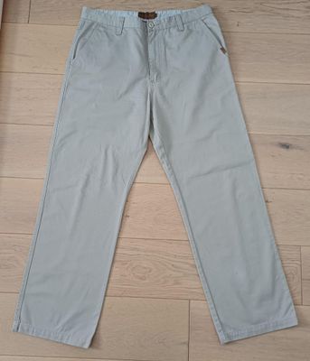 Pantalon toile beige. Occasion, bon état.