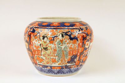 a vase that is sitting on a white surface