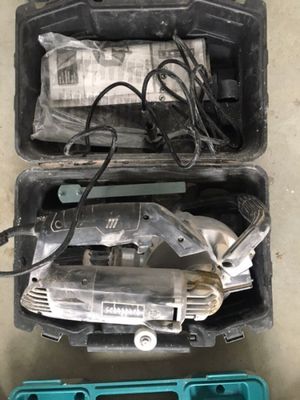 two tools in the case on the floor next to each other