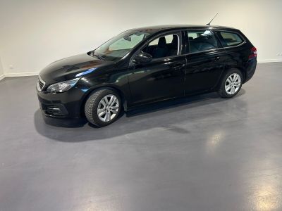a picture of a black car parked in a garage