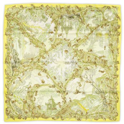 a yellow and white square scarf with a floral design