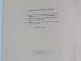 an open book on a blue surface with a white background