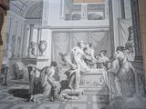 a man standing in front of a painting on the wall