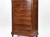 a wooden chest of drawers with four drawers on one side and three drawers on the other
